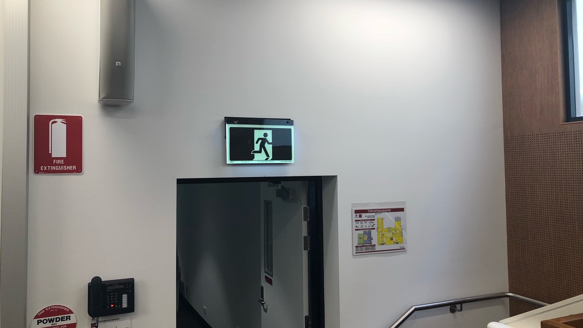 Safety Path Hybrid Exit Sign in stairwell of Melbourne Business School